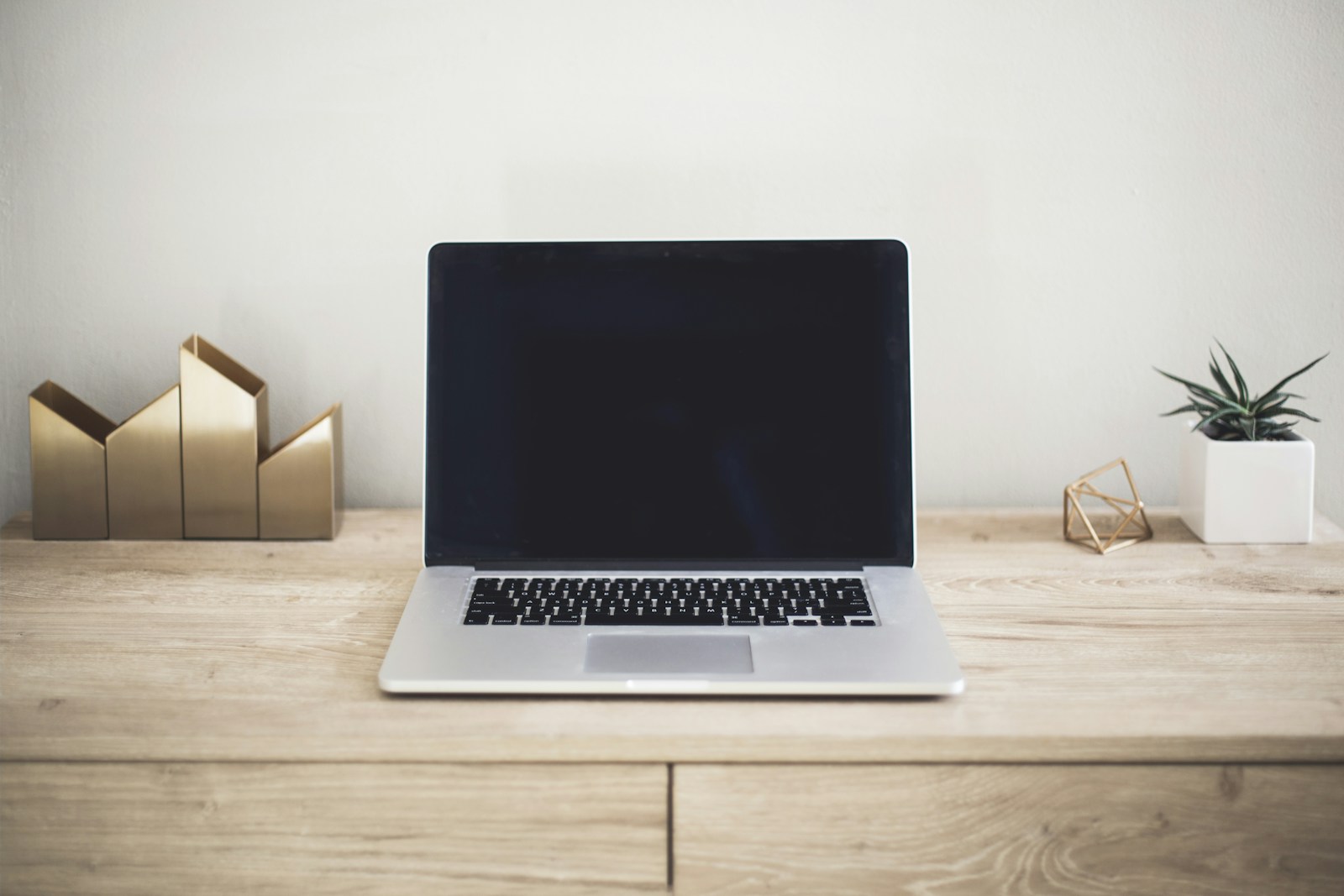 Laptop on a desk in a professional workspace